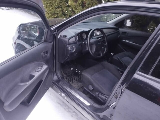 Чорний Міцубісі Аутлендер, об'ємом двигуна 2 л та пробігом 251 тис. км за 4990 $, фото 14 на Automoto.ua