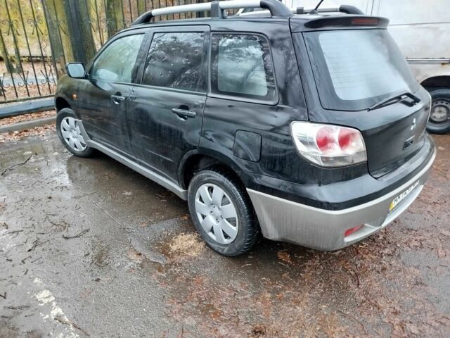 Чорний Міцубісі Аутлендер, об'ємом двигуна 2 л та пробігом 251 тис. км за 4990 $, фото 16 на Automoto.ua