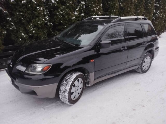 Чорний Міцубісі Аутлендер, об'ємом двигуна 2 л та пробігом 251 тис. км за 4990 $, фото 7 на Automoto.ua