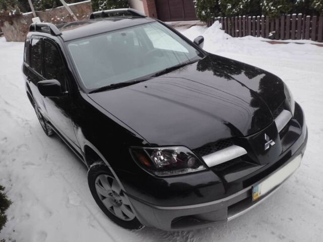 Чорний Міцубісі Аутлендер, об'ємом двигуна 2 л та пробігом 251 тис. км за 4990 $, фото 5 на Automoto.ua