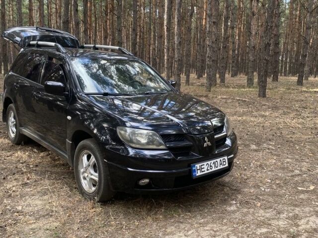 Черный Мицубиси Аутлендер, объемом двигателя 2.4 л и пробегом 312 тыс. км за 6500 $, фото 3 на Automoto.ua