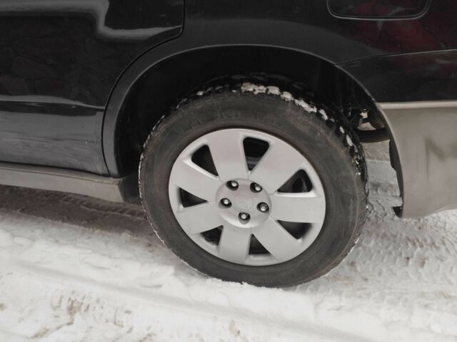 Чорний Міцубісі Аутлендер, об'ємом двигуна 2 л та пробігом 251 тис. км за 4990 $, фото 12 на Automoto.ua