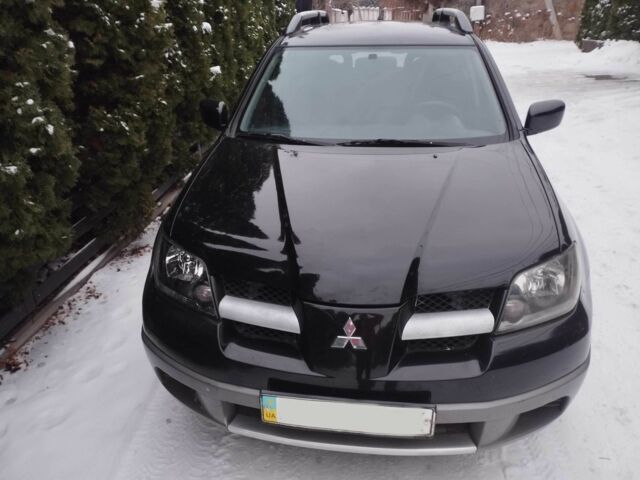 Чорний Міцубісі Аутлендер, об'ємом двигуна 2 л та пробігом 251 тис. км за 4990 $, фото 10 на Automoto.ua