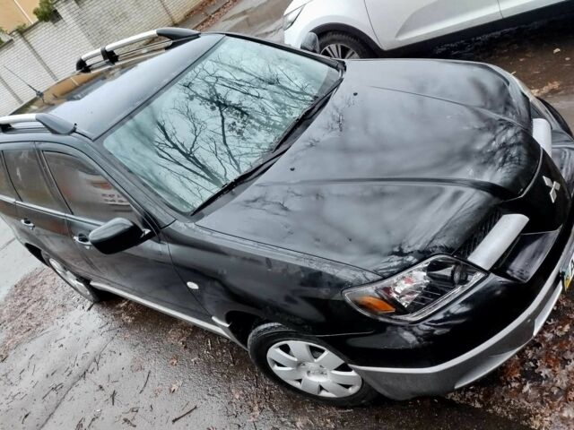 Чорний Міцубісі Аутлендер, об'ємом двигуна 2 л та пробігом 251 тис. км за 4990 $, фото 17 на Automoto.ua