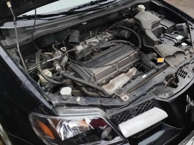 Чорний Міцубісі Аутлендер, об'ємом двигуна 2 л та пробігом 251 тис. км за 4990 $, фото 15 на Automoto.ua