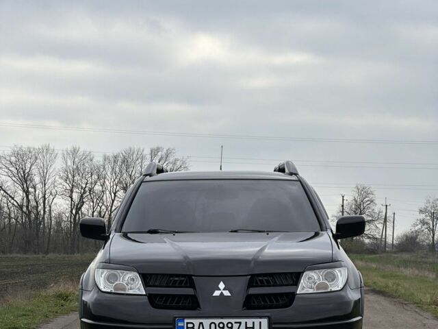 Чорний Міцубісі Аутлендер, об'ємом двигуна 2 л та пробігом 230 тис. км за 6300 $, фото 1 на Automoto.ua