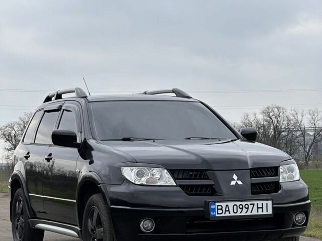 Чорний Міцубісі Аутлендер, об'ємом двигуна 2 л та пробігом 230 тис. км за 6300 $, фото 4 на Automoto.ua