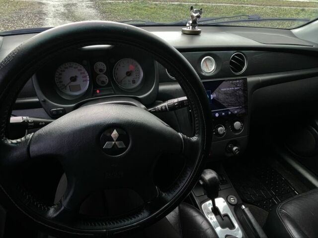 Черный Мицубиси Аутлендер, объемом двигателя 2.4 л и пробегом 200 тыс. км за 5800 $, фото 6 на Automoto.ua