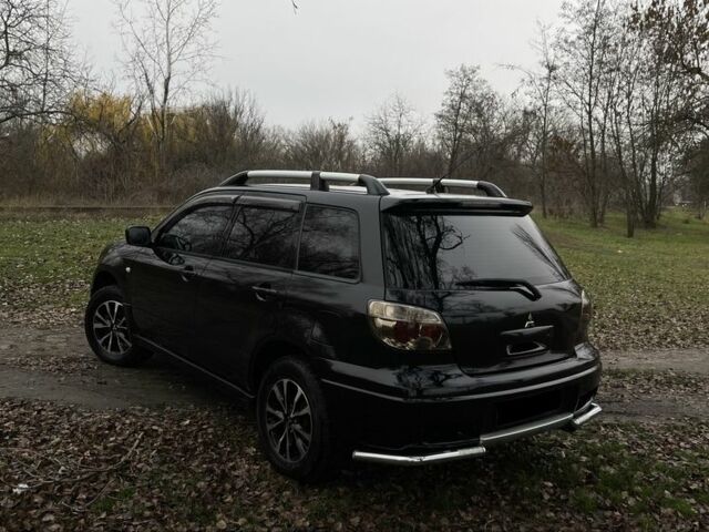 Черный Мицубиси Аутлендер, объемом двигателя 2.4 л и пробегом 200 тыс. км за 5800 $, фото 4 на Automoto.ua