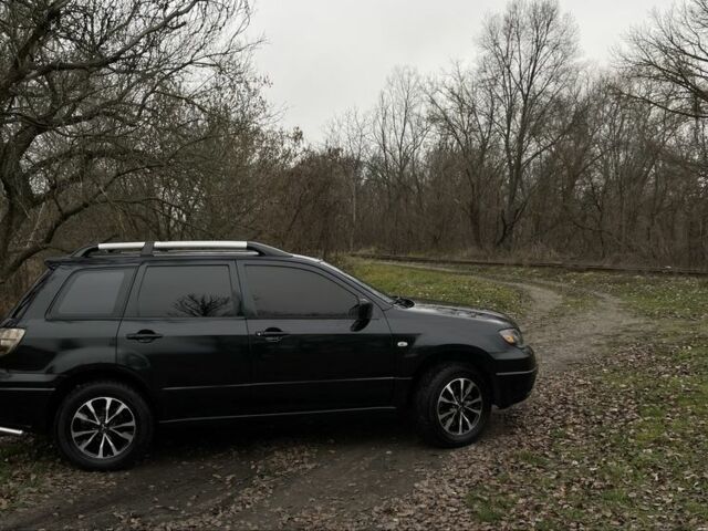 Черный Мицубиси Аутлендер, объемом двигателя 2.4 л и пробегом 200 тыс. км за 5800 $, фото 5 на Automoto.ua