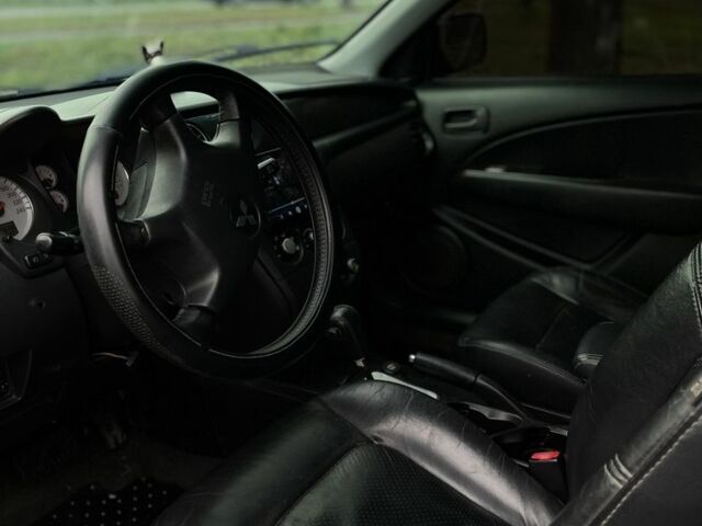 Черный Мицубиси Аутлендер, объемом двигателя 2.4 л и пробегом 200 тыс. км за 5800 $, фото 8 на Automoto.ua