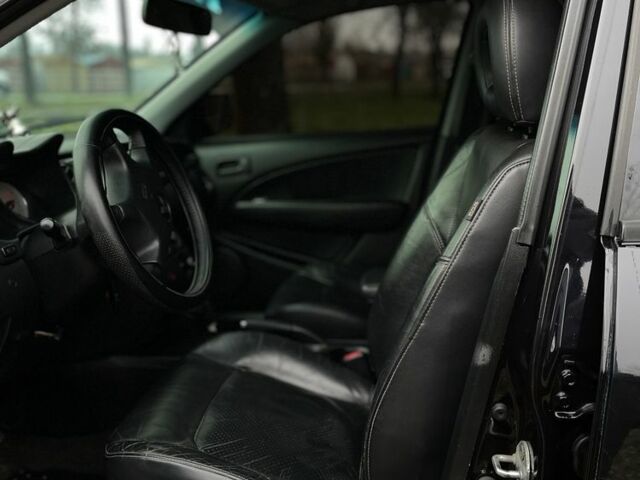 Черный Мицубиси Аутлендер, объемом двигателя 2.4 л и пробегом 200 тыс. км за 5800 $, фото 7 на Automoto.ua