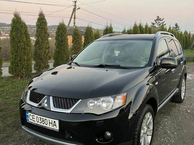 Черный Мицубиси Аутлендер, объемом двигателя 2.2 л и пробегом 238 тыс. км за 9700 $, фото 1 на Automoto.ua
