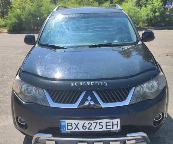 Чорний Міцубісі Аутлендер, об'ємом двигуна 2.4 л та пробігом 180 тис. км за 9000 $, фото 1 на Automoto.ua