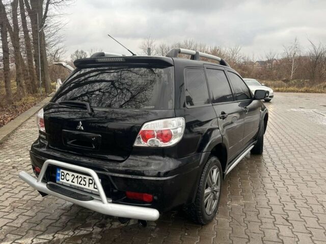 Черный Мицубиси Аутлендер, объемом двигателя 2.4 л и пробегом 244 тыс. км за 6800 $, фото 5 на Automoto.ua