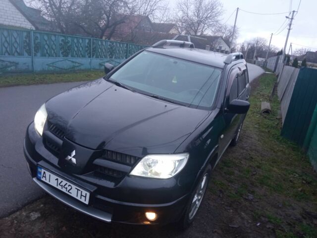 Чорний Міцубісі Аутлендер, об'ємом двигуна 2 л та пробігом 220 тис. км за 5599 $, фото 2 на Automoto.ua