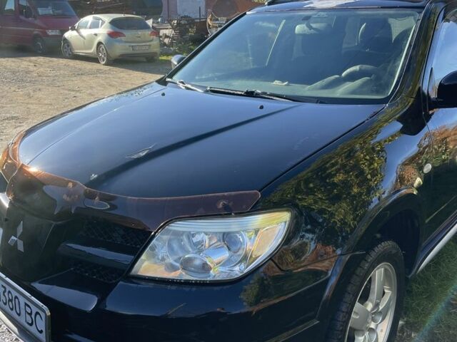 Черный Мицубиси Аутлендер, объемом двигателя 2 л и пробегом 156 тыс. км за 4200 $, фото 3 на Automoto.ua