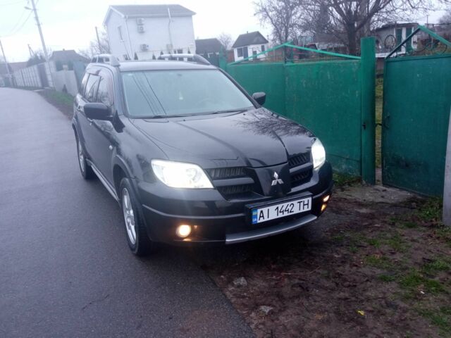 Чорний Міцубісі Аутлендер, об'ємом двигуна 2 л та пробігом 220 тис. км за 5599 $, фото 3 на Automoto.ua