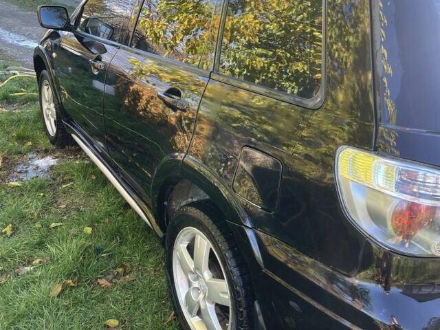 Черный Мицубиси Аутлендер, объемом двигателя 2 л и пробегом 156 тыс. км за 4200 $, фото 4 на Automoto.ua