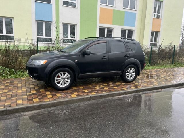 Чорний Міцубісі Аутлендер, об'ємом двигуна 2.4 л та пробігом 260 тис. км за 10000 $, фото 1 на Automoto.ua