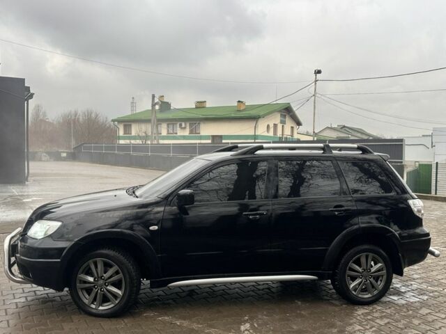 Черный Мицубиси Аутлендер, объемом двигателя 2.4 л и пробегом 244 тыс. км за 6800 $, фото 2 на Automoto.ua