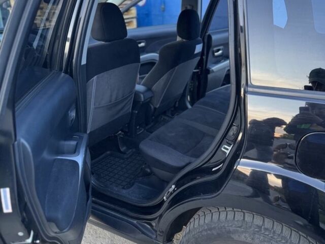 Черный Мицубиси Аутлендер, объемом двигателя 2.4 л и пробегом 220 тыс. км за 9500 $, фото 7 на Automoto.ua