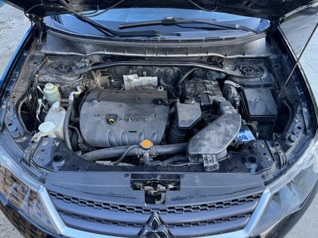 Черный Мицубиси Аутлендер, объемом двигателя 2.4 л и пробегом 220 тыс. км за 9500 $, фото 5 на Automoto.ua