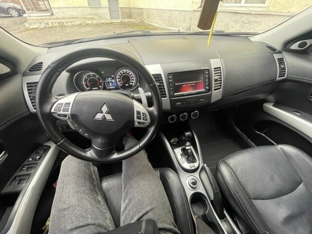 Черный Мицубиси Аутлендер, объемом двигателя 2.2 л и пробегом 186 тыс. км за 11200 $, фото 1 на Automoto.ua