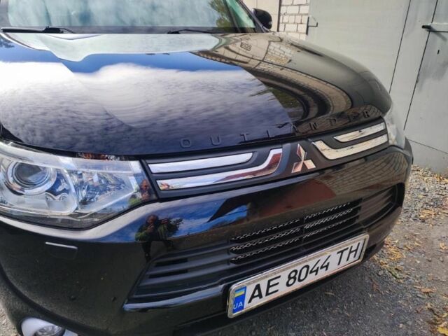 Черный Мицубиси Аутлендер, объемом двигателя 2.4 л и пробегом 220 тыс. км за 13400 $, фото 1 на Automoto.ua