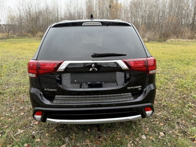 Черный Мицубиси Аутлендер, объемом двигателя 2.4 л и пробегом 130 тыс. км за 14950 $, фото 5 на Automoto.ua