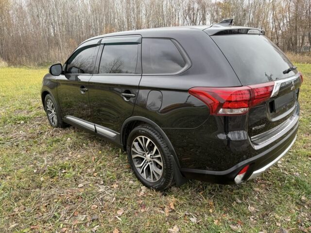 Черный Мицубиси Аутлендер, объемом двигателя 2.4 л и пробегом 130 тыс. км за 14950 $, фото 4 на Automoto.ua