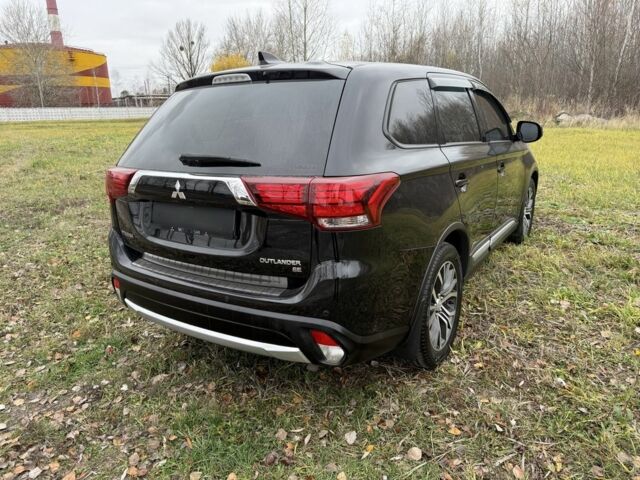 Черный Мицубиси Аутлендер, объемом двигателя 2.4 л и пробегом 130 тыс. км за 14950 $, фото 3 на Automoto.ua