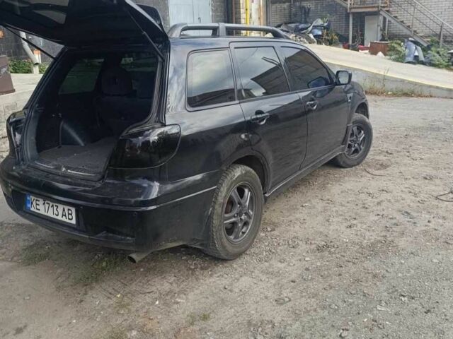 Чорний Міцубісі Аутлендер, об'ємом двигуна 2.4 л та пробігом 212 тис. км за 4800 $, фото 11 на Automoto.ua