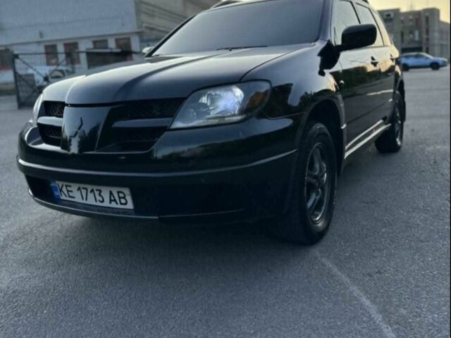 Чорний Міцубісі Аутлендер, об'ємом двигуна 2.4 л та пробігом 212 тис. км за 4800 $, фото 7 на Automoto.ua