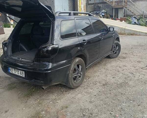 Черный Мицубиси Аутлендер, объемом двигателя 2.38 л и пробегом 212 тыс. км за 4800 $, фото 5 на Automoto.ua