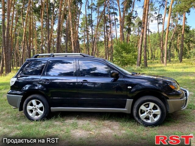 Черный Мицубиси Аутлендер, объемом двигателя 2 л и пробегом 195 тыс. км за 5650 $, фото 10 на Automoto.ua