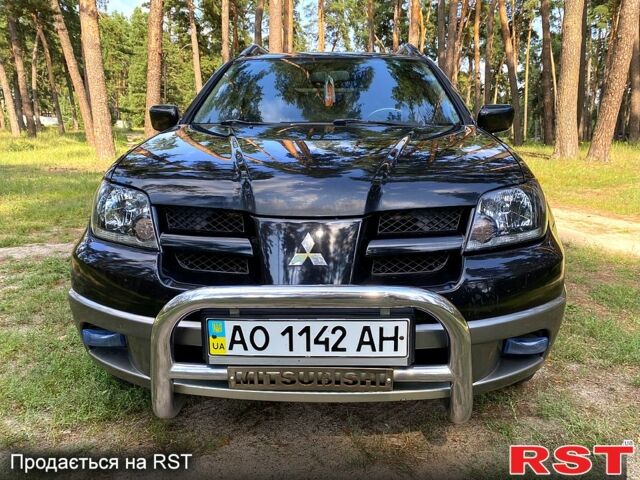 Черный Мицубиси Аутлендер, объемом двигателя 2 л и пробегом 195 тыс. км за 5650 $, фото 2 на Automoto.ua