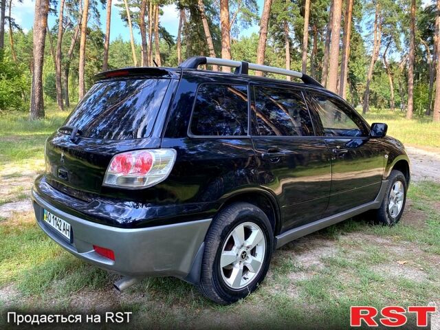 Черный Мицубиси Аутлендер, объемом двигателя 2 л и пробегом 195 тыс. км за 5650 $, фото 8 на Automoto.ua