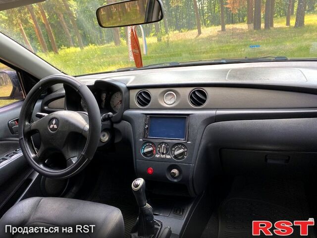 Черный Мицубиси Аутлендер, объемом двигателя 2 л и пробегом 195 тыс. км за 5650 $, фото 11 на Automoto.ua