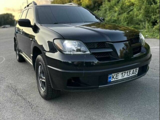 Чорний Міцубісі Аутлендер, об'ємом двигуна 2.4 л та пробігом 212 тис. км за 4800 $, фото 6 на Automoto.ua