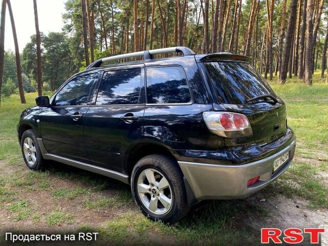 Черный Мицубиси Аутлендер, объемом двигателя 2 л и пробегом 195 тыс. км за 5650 $, фото 3 на Automoto.ua