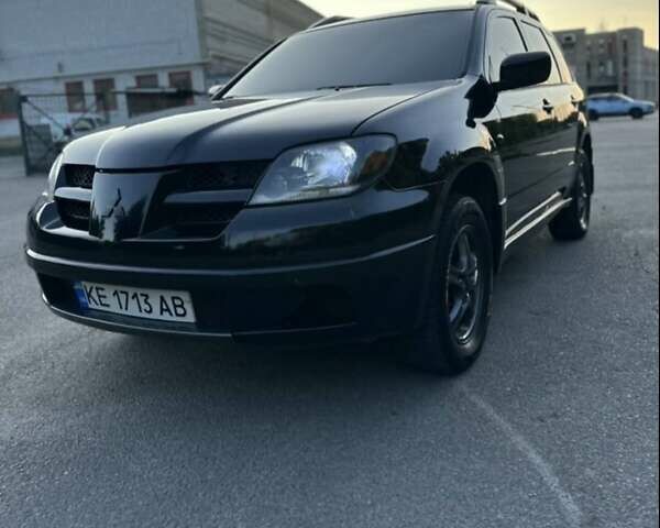 Черный Мицубиси Аутлендер, объемом двигателя 2.38 л и пробегом 212 тыс. км за 4800 $, фото 1 на Automoto.ua