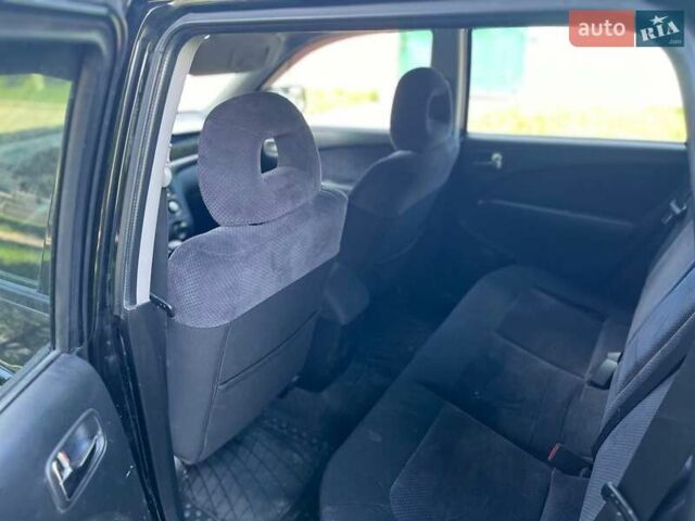 Черный Мицубиси Аутлендер, объемом двигателя 2.36 л и пробегом 130 тыс. км за 5400 $, фото 5 на Automoto.ua