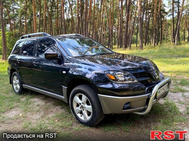 Черный Мицубиси Аутлендер, объемом двигателя 2 л и пробегом 195 тыс. км за 5650 $, фото 9 на Automoto.ua