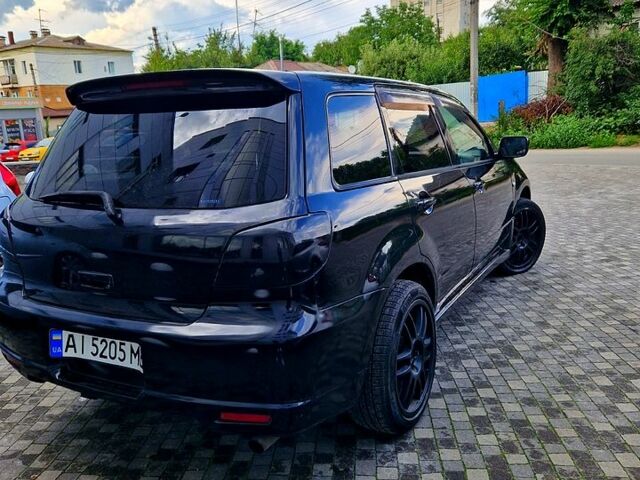 Чорний Міцубісі Аутлендер, об'ємом двигуна 2 л та пробігом 143 тис. км за 8500 $, фото 4 на Automoto.ua