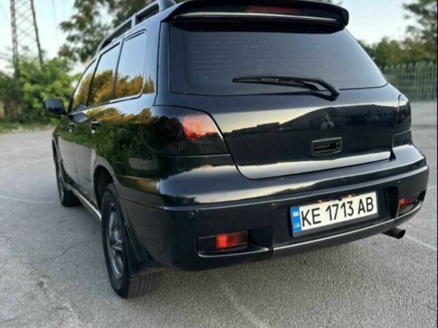 Чорний Міцубісі Аутлендер, об'ємом двигуна 2.4 л та пробігом 212 тис. км за 4800 $, фото 8 на Automoto.ua