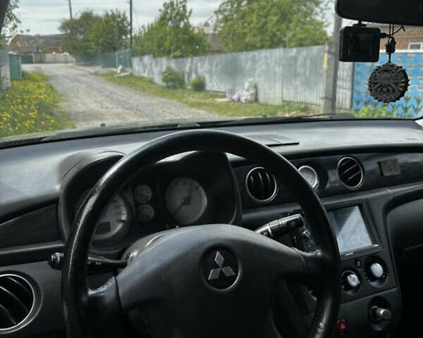 Чорний Міцубісі Аутлендер, об'ємом двигуна 2 л та пробігом 321 тис. км за 5500 $, фото 2 на Automoto.ua