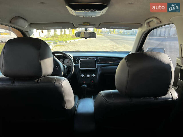 Черный Мицубиси Аутлендер, объемом двигателя 2.4 л и пробегом 267 тыс. км за 6900 $, фото 15 на Automoto.ua