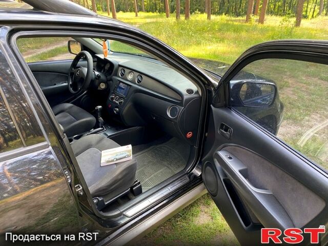 Черный Мицубиси Аутлендер, объемом двигателя 2 л и пробегом 195 тыс. км за 5650 $, фото 7 на Automoto.ua