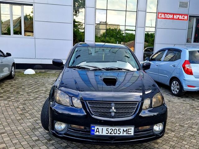 Чорний Міцубісі Аутлендер, об'ємом двигуна 2 л та пробігом 143 тис. км за 8500 $, фото 2 на Automoto.ua
